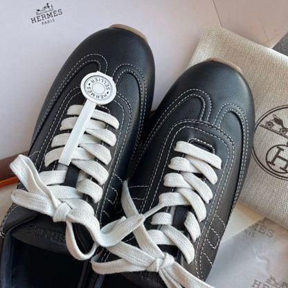 Hermès Master Sneakers in the classic Black/White colorway.