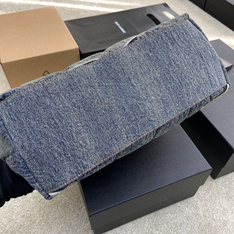 Saint Laurent Loulou Puffer bag in quilted denim.