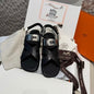 Hermès Ines Sandals in black calfskin