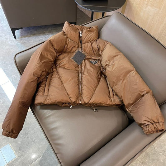 Prada cropped puffer jacket in a brown color