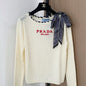 Prada crew-neck sweater with a silk scarf