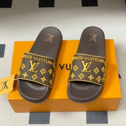Louis Vuitton Monogram Flats or slides.