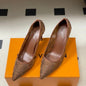 Louis Vuitton Gala Pumps in a sophisticated brown/tan colorway.