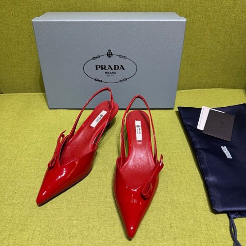 Prada Patent Leather Bow Slingback Pumps in a vibrant red colorway.