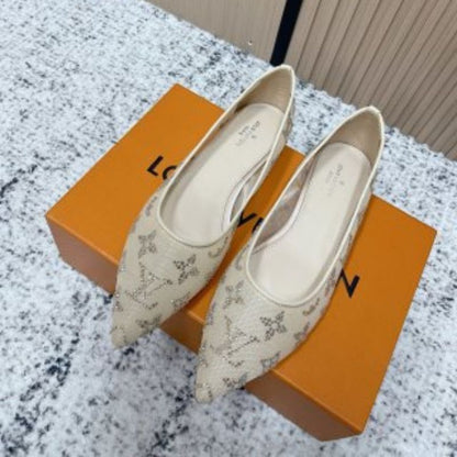 Louis Vuitton Gala Flat Ballerinas in a beige or nude color.