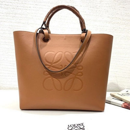 Loewe Anagram Leather Tote with Wicker Handles.