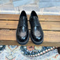 Prada Brushed Leather Brogues with Platform Sole in classic black ("Nero").