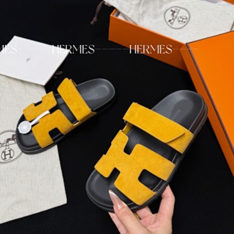 Hermès Chypre Sandals in a vibrant yellow shade,
