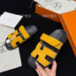 Hermès Chypre Sandals in a vibrant yellow shade,