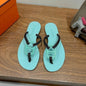 Hermès Kala Nera Sandals in a mint green and black
