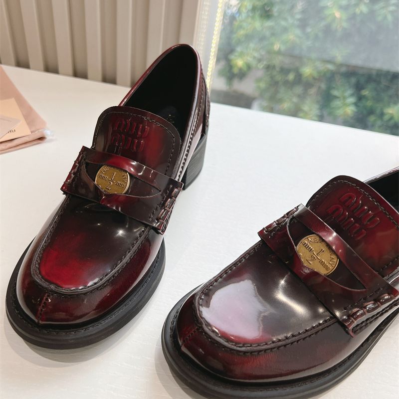 Miu Miu Brushed Leather Penny Loafers with a lug sole.