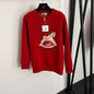 Hermès  red knit sweater featuring a white horse graphic