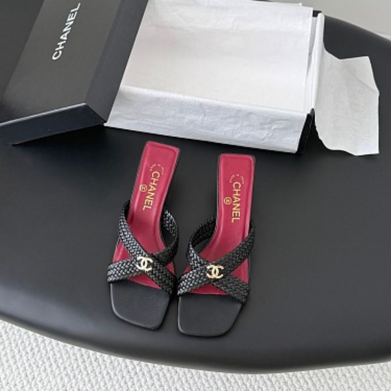 Chanel Braided Interlocking CC Mule Sandals in black.