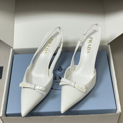 Prada Vernice Patent Leather Bow Slingback Pumps.
