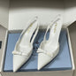 Prada Vernice Patent Leather Bow Slingback Pumps.