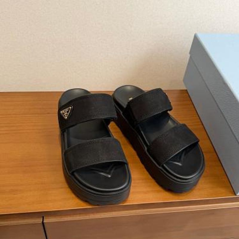 Prada Nubuck Flatform Slides in black.