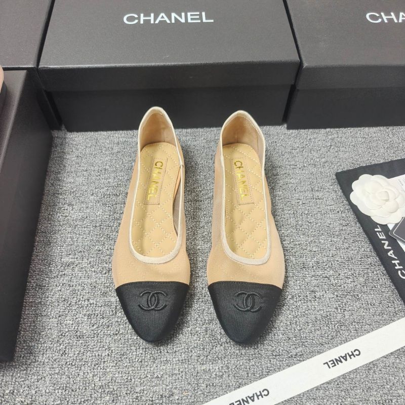 Chanel Ballet Flats in a two-tone beige and black colorway.
