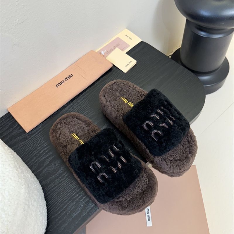 e Miu Miu Shearling logo-embellished Slippers.