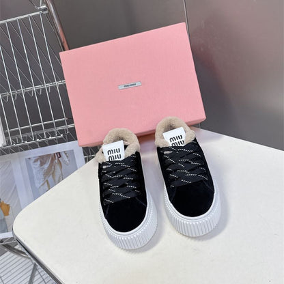Miu Miu Plume Shearling Sneakers.