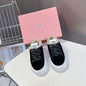 Miu Miu Plume Shearling Sneakers.