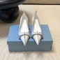 Prada Antiqued Leather Pointed-Toe Flats in the white and tan ("Bianco + Cuoio") colorway.