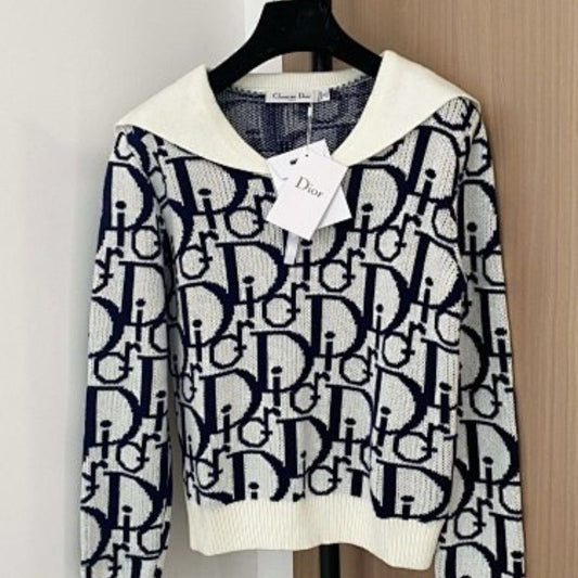 white and navy blue Christian Dior knit top with a white collar