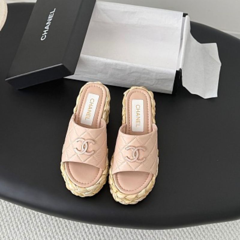 Chanel Quilted Interlocking CC Straw Platform Mules in light pink.