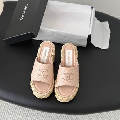 Chanel Quilted Interlocking CC Straw Platform Mules in light pink.
