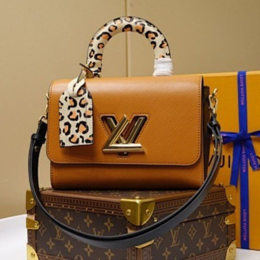 Louis Vuitton Twist MM in Gold Miel