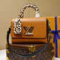 Louis Vuitton Twist MM in Gold Miel
