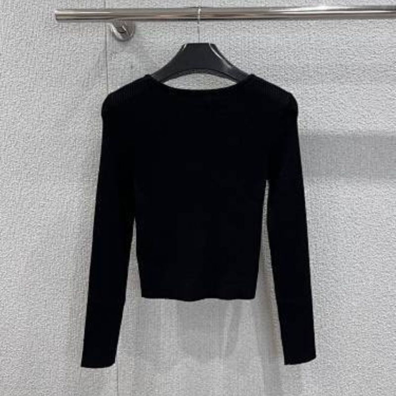 Celine cropped long-sleeved cardigan with metallic buttons.