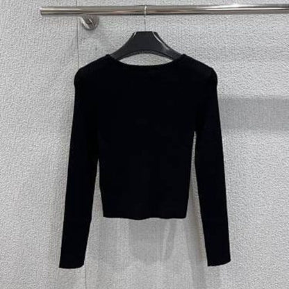 Celine cropped long-sleeved cardigan with metallic buttons.