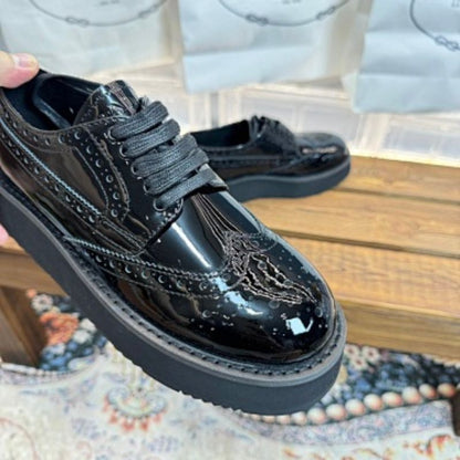 Prada Brushed Leather Brogues with Platform Sole in classic black ("Nero").