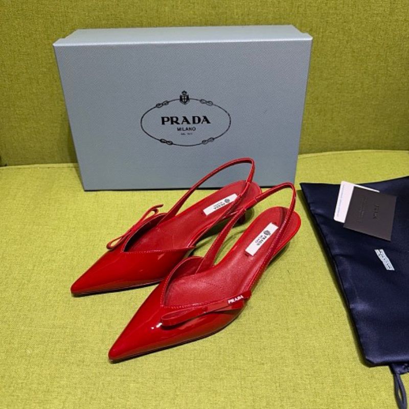 Prada Patent Leather Bow Slingback Pumps in a vibrant red colorway.