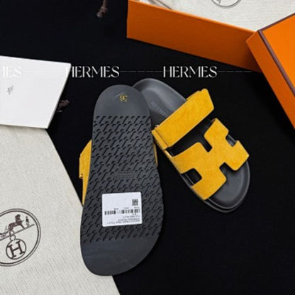 Hermès Chypre Sandals in a vibrant yellow shade,