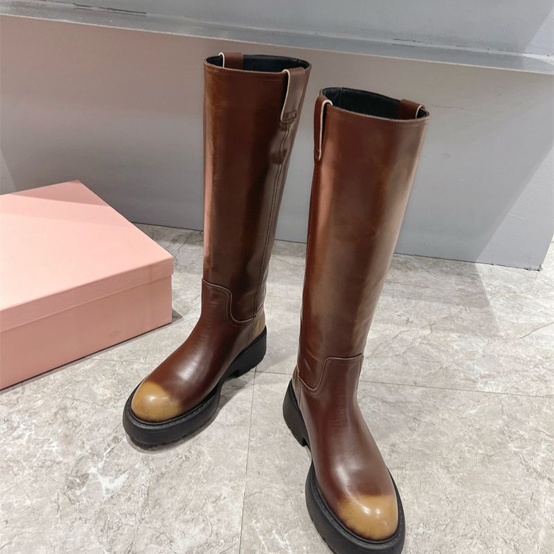 Miu Miu Knee-High Boots with a chunky sole