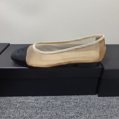 Chanel Ballet Flats in a two-tone beige and black colorway.