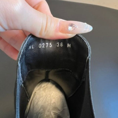 Louis Vuitton LV Squad Chelsea Ankle Boots in black.