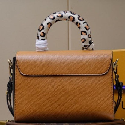 Louis Vuitton Twist MM in Gold Miel