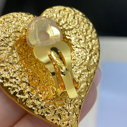 Yves Saint Laurent (YSL) multi-textured heart-in-heart earrings