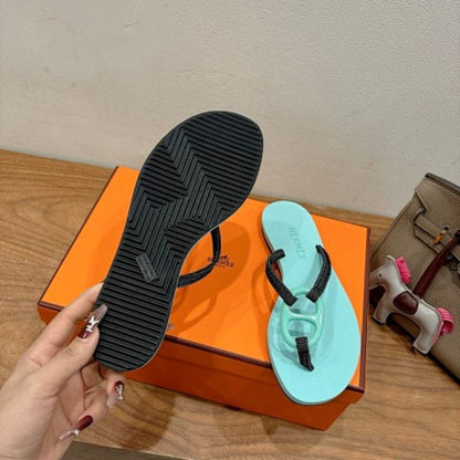 Hermès Kala Nera Sandals in a mint green and black