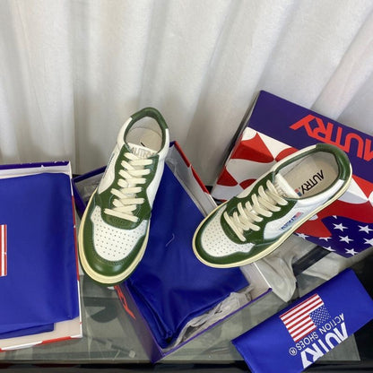 Louis Vuitton Low-Top Sneakers in a white and green