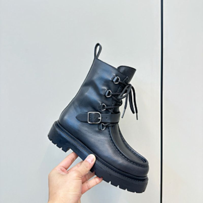 Hermès Land ankle boots in a classic black colorway.