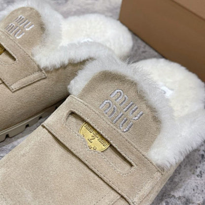 Miu Miu Suede Mules with Shearling lining.