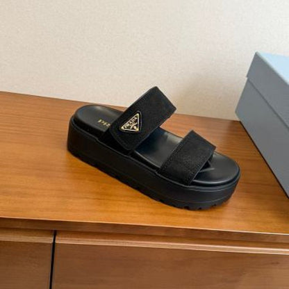 Prada Nubuck Flatform Slides in black.