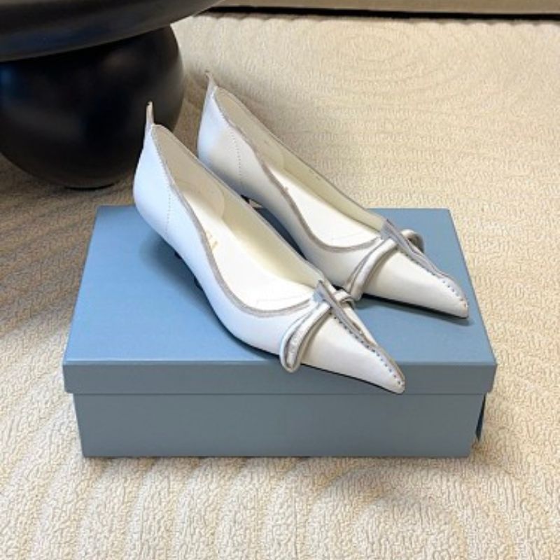 Prada Antiqued Leather Pointed-Toe Flats in the white and tan ("Bianco + Cuoio") colorway.