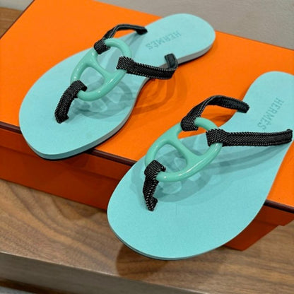 Hermès Kala Nera Sandals in a mint green and black