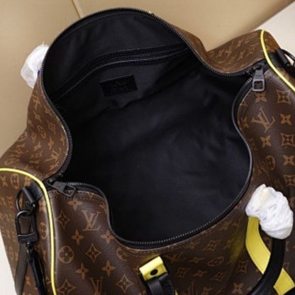 Louis Vuitton Keepall Bandoulière 50 in Monogram Macassar.