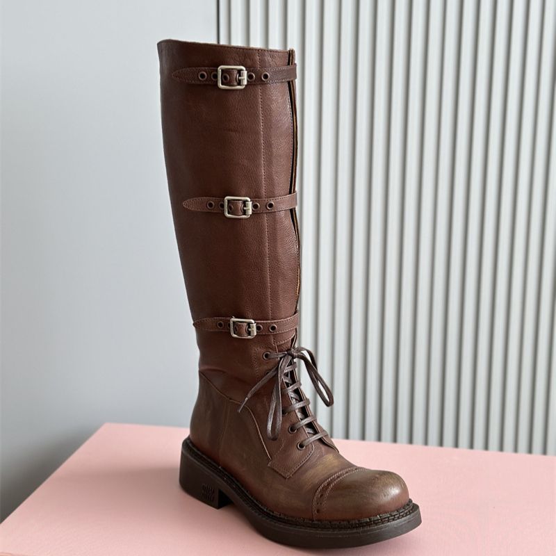 Miu Miu Tall Leather Boots with Straps and Buckles.