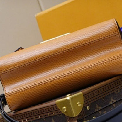 Louis Vuitton Twist MM in Gold Miel